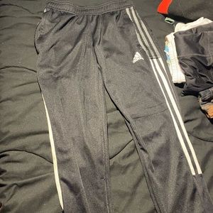 Black and white striped Adidas pants